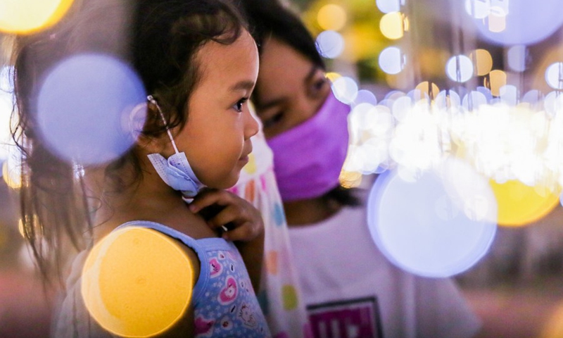 Children are seen inside a Christmas light tunnel at the Quezon Memorial Circle in Quezon City, the Philippines, Nov. 28, 2022.(Photo: Xinhua)