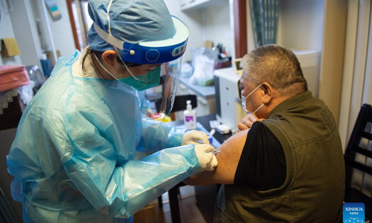 An elderly resident receives a shot of COVID-19 vaccine at home in Dongcheng District of Beijing, capital of China, May 10, 2022. Medical workers on Tuesday provided home services to some elderly residents who preferred to receive COVID-19 vaccination at home due to their health conditions. (Xinhua/Chen Zhonghao)