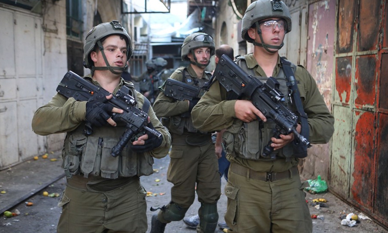 Israeli soldiers deploy during clashes with Palestinians in the West Bank city of Hebron on Nov. 19, 2022. (Photo: Xinhua)