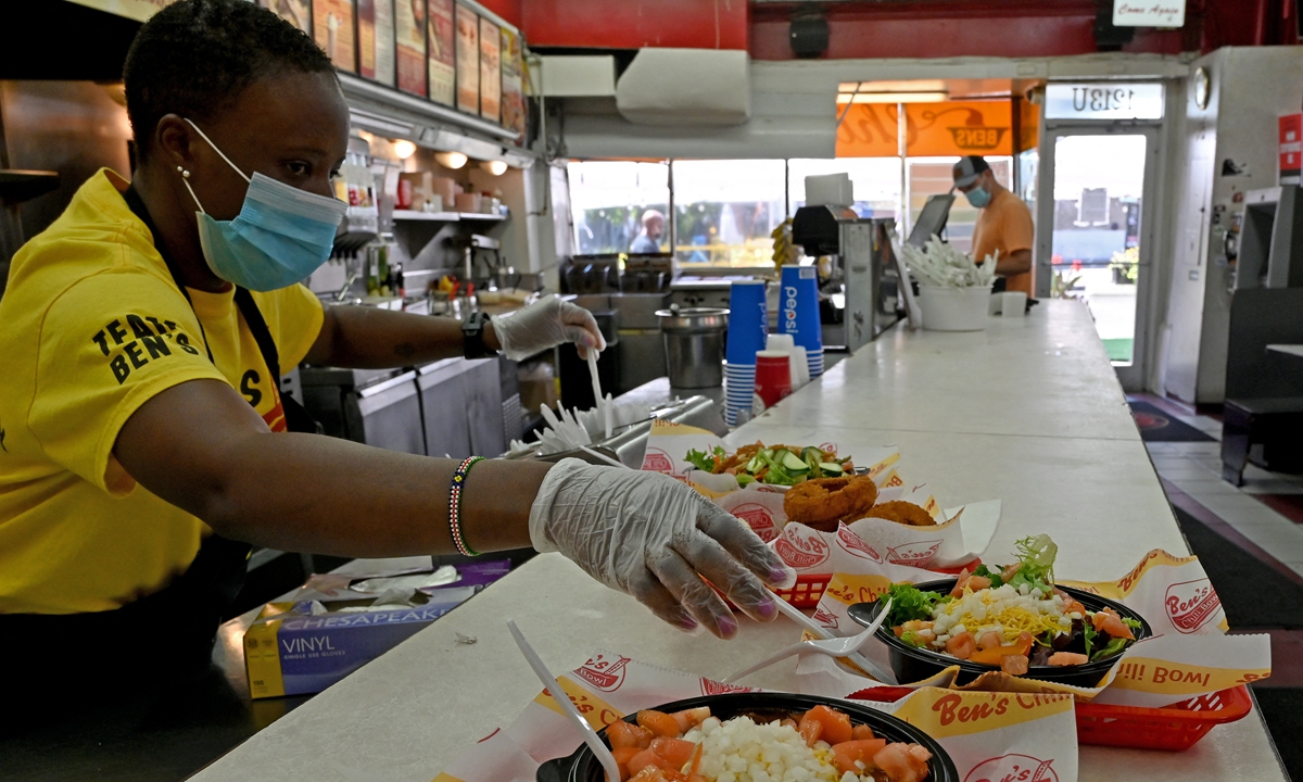 An employee prepares food at a fast food restaurant in Washington DC. File photo: AFP