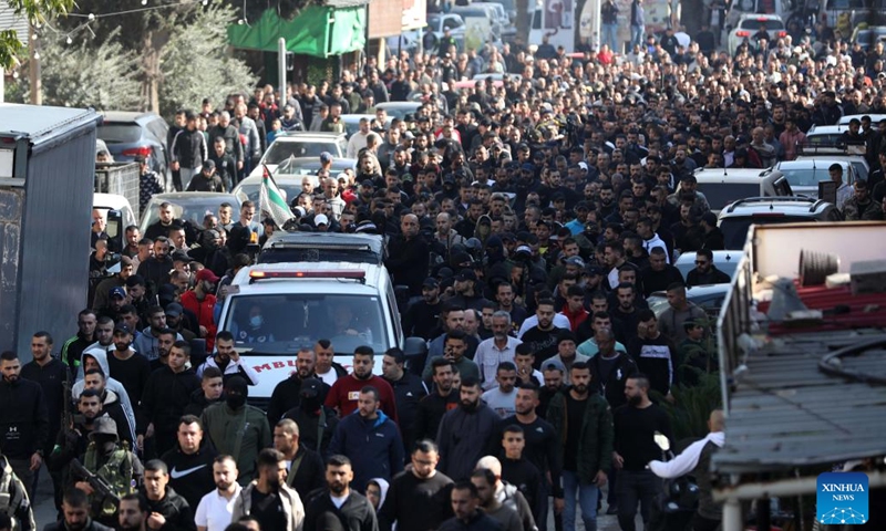People attend a funeral in the West Bank city of Jenin, on Dec. 1, 2022. Two Palestinian militants were killed on Thursday during clashes with Israeli soldiers in the Jenin refugee camp in the northern West Bank, Palestinian medics and local sources said.(Photo: Xinhua)
