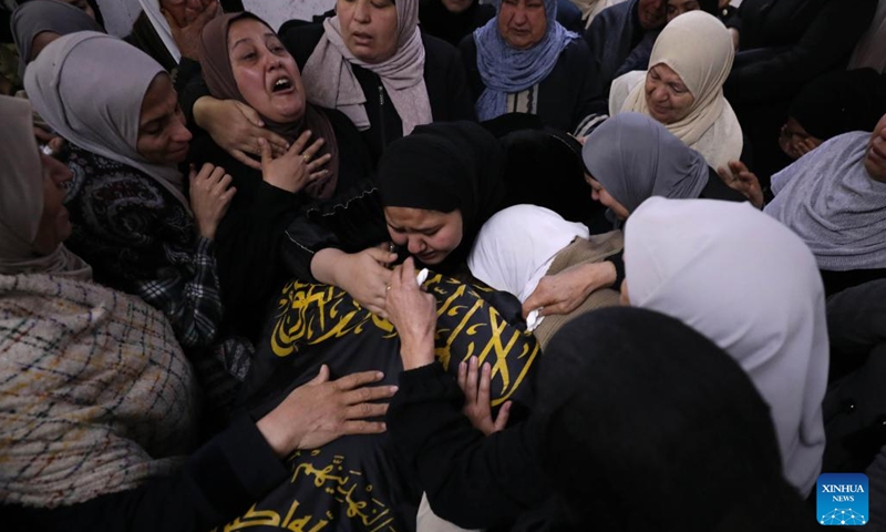 People mourn during a funeral in the West Bank city of Jenin, on Dec. 1, 2022. Two Palestinian militants were killed on Thursday during clashes with Israeli soldiers in the Jenin refugee camp in the northern West Bank, Palestinian medics and local sources said.(Photo: Xinhua)