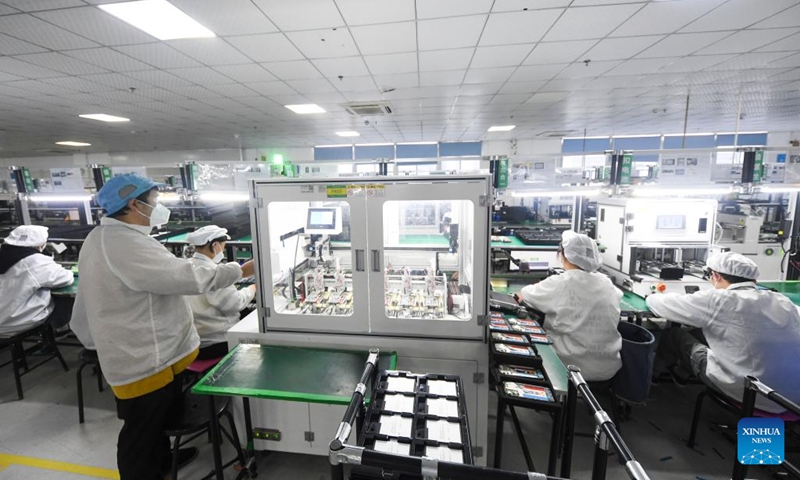 Staff members work at the smartphone production and quality control workshop of Chongqing Transsion Technology Co., Ltd. in Yubei District of southwest China's Chongqing, Dec. 3, 2022. In recent years, Yubei District of Chongqing has sped up efforts to promote the transformation of traditional industries and boost the development of intelligent manufacturing. (Xinhua/Wang Quanchao)