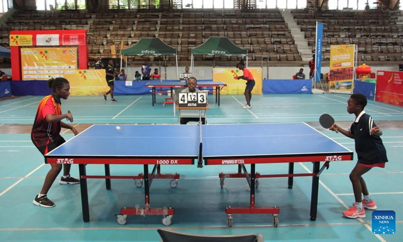 Players compete in a table tennis match as part of the celebration of 50 years of friendship between China and Benin, in Cotonou, Benin, Dec. 4, 2022. (Photo by Seraphin Zounyekpe/Xinhua)