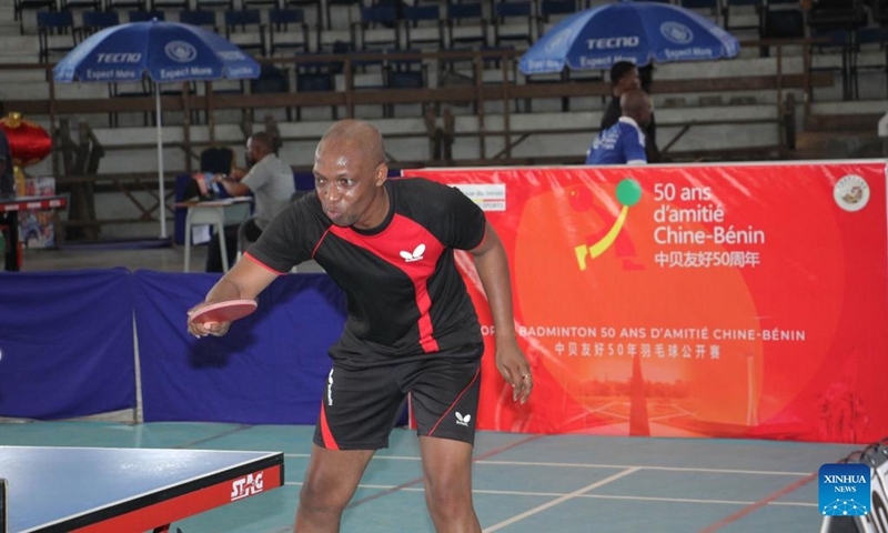 A player competes in a table tennis match as part of the celebration of 50 years of friendship between China and Benin, in Cotonou, Benin, Dec. 4, 2022. (Photo by Seraphin Zounyekpe/Xinhua)