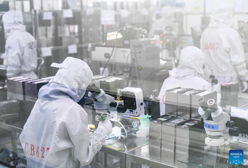 Staff members work at the workshop of Chongqing TS-Precision Technology Co., Ltd. in Yubei District of southwest China's Chongqing, Dec. 3, 2022. In recent years, Yubei District of Chongqing has sped up efforts to promote the transformation of traditional industries and boost the development of intelligent manufacturing. (Xinhua/Wang Quanchao)