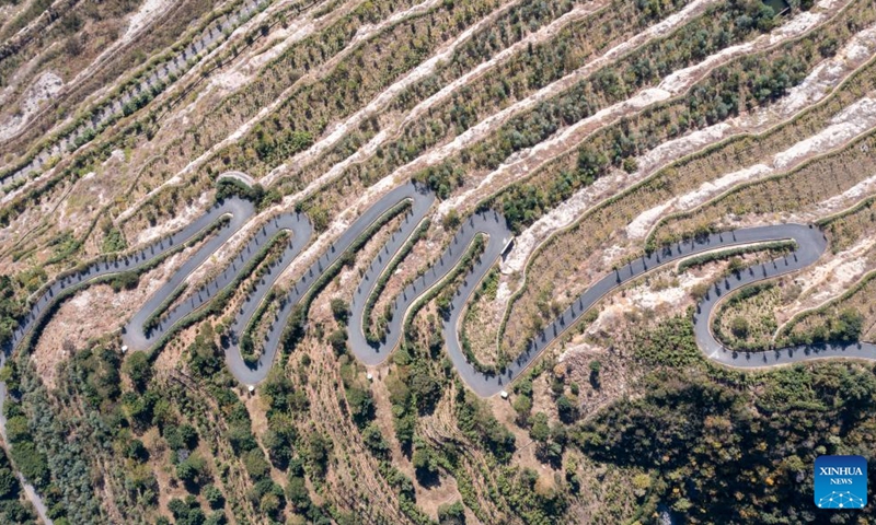 This aerial photo shows a paved road in a mining site after ecological restoration in a cycad national nature reserve in Panzhihua, southwest China's Sichuan Province, Nov. 28, 2022. The city of Panzhihua boasts China's only national-level cycad nature reserve, with over 385,000 cycad plants.(Photo: Xinhua)
