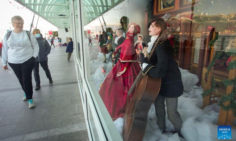 People look at vintage Christmas window displays at Canada Place in Vancouver, British Columbia, Canada, on Dec. 12, 2022. The vintage Christmas window displays are now for viewing here as part of the Christmas highlights in Vancouver.(Photo: Xinhua)