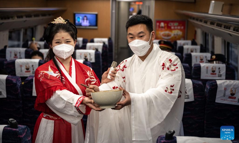Conductors perform on a trial running train of Mile-Mengzi high-speed railway in southwest China's Yunnan Province, Dec. 14, 2022. The 107-km railway will link the cities of Mile and Mengzi, both located in Yunnan's Honghe Hani and Yi Autonomous Prefecture. Passenger trains operating on the railway are due to travel at 250 km per hour.(Photo: Xinhua)