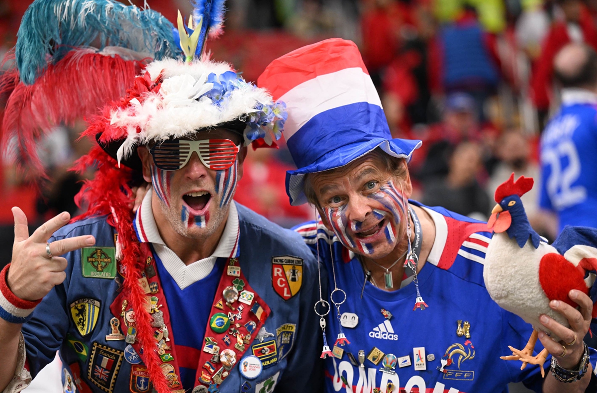 France supporters pose for a picture ahead of the World Cup semifinal match between France and Morocco on December 14, 2022. Photo: AFP