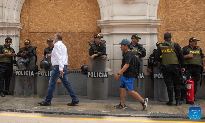Police officers stand guard in Lima, Peru, Dec. 14, 2022. Peru declared a nationwide 30-day state of emergency on Wednesday in a bid to quash sometimes violent protests in various regions, Defense Minister Alberto Otarola said.(Photo: Xinhua)