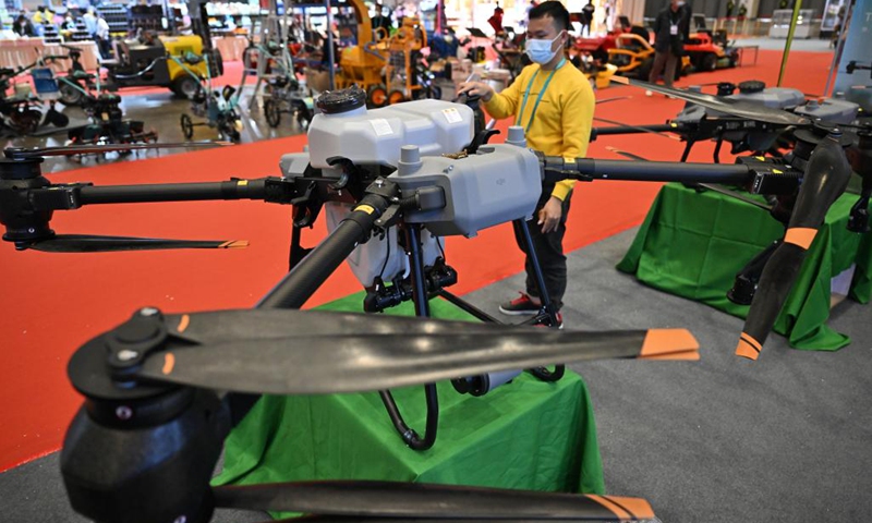 This photo taken on Dec. 15, 2022 shows an unmanned aerial vehicle (UAV) for plant protection at the 2022 China (Hainan) International Tropical Agricultural Products Winter Trade Fair in Haikou, south China's Hainan Province. The 2022 China (Hainan) International Tropical Agricultural Products Winter Trade Fair kicked off here on Thursday in the Hainan International Convention and Exhibition Center.(Photo: Xinhua)