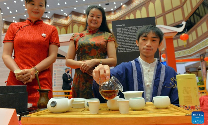 People demonstrate traditional Chinese tea ceremony during a China Day cultural event in Bandar Seri Begawan, Brunei, on Dec. 16, 2022. The China Day cultural event, as part of the Brunei December Festival, was launched here at the International Convention Center on Friday. A series of activities showcasing Chinese cultures such as wushu, calligraphy, delicacy, and sales of Chinese goods and specialties will be staged during the three-day cultural event. (Photo by Jeffrey Wong/Xinhua)