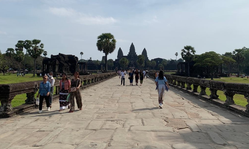 Tourists visit the Angkor Wat in the Angkor Archaeological Park in Siem Reap province, Cambodia, Dec. 17, 2022. (Photo by Van Pov/Xinhua)