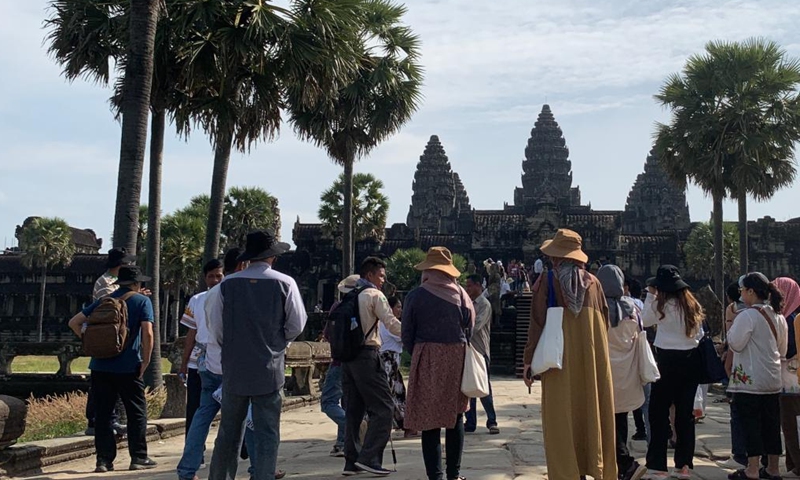 Tourists visit the Angkor Wat in the Angkor Archaeological Park in Siem Reap province, Cambodia, Dec. 17, 2022. (Photo by Van Pov/Xinhua)