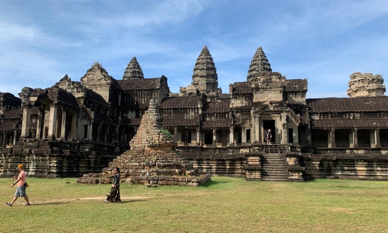 Tourists visit the Angkor Wat in the Angkor Archaeological Park in Siem Reap province, Cambodia, Dec. 17, 2022. (Photo by Van Pov/Xinhua)