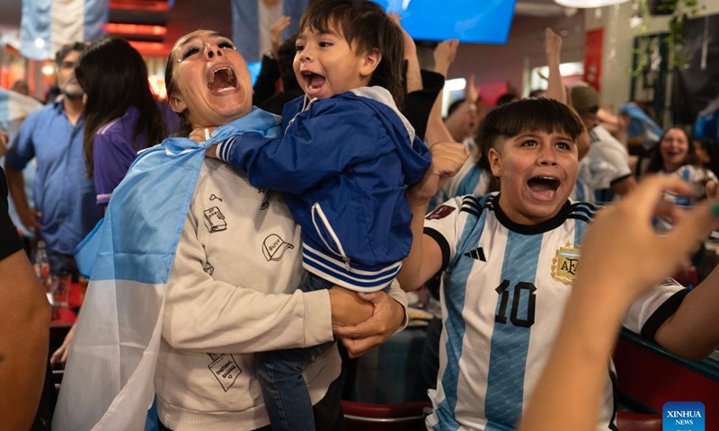 Fans of Argentina celebrate after their team winning the Final of the 2022 FIFA World Cup in Buenos Aires, capital of Argentina, Dec. 18, 2022. (Photo by Martin Zabala/Xinhua)