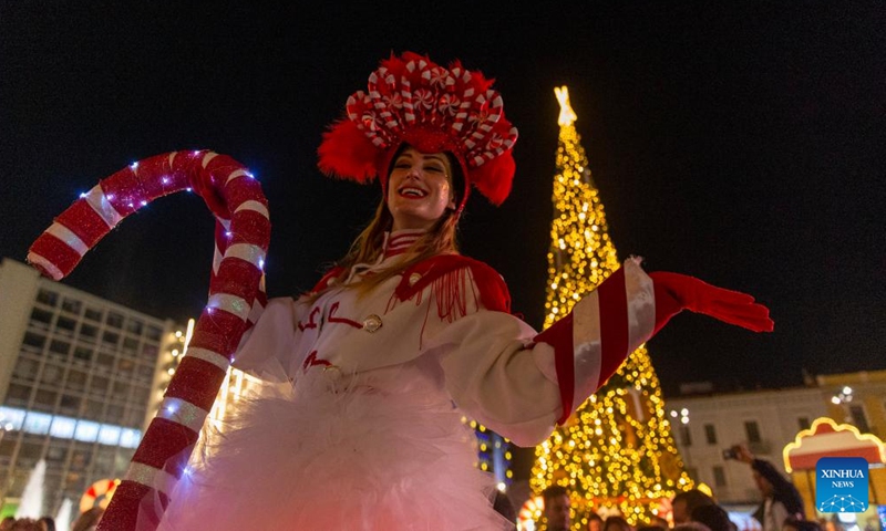 A performer attends a Christmas event at Omonoia square in Athens, Greece, on Dec. 18, 2022. (Xinhua/Marios Lolos)