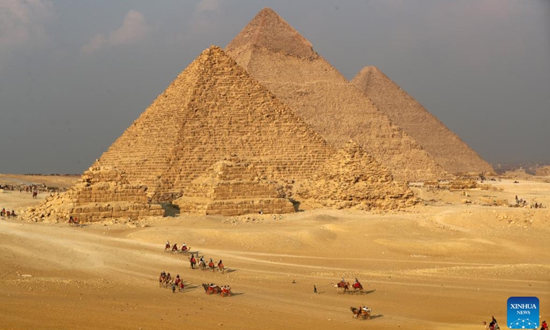 Tourists visit the Giza Pyramids scenic spot in Giza, Egypt, on Dec. 22, 2022.(Photo: Xinhua)