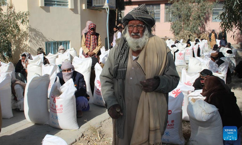 Afghans receive China-donated humanitarian aid in Nimroz province, Afghanistan, Dec. 20, 2022. Provincial authorities distributed another batch of China-donated aid among 450 needy families in Afghanistan's western Nimroz province Wednesday, Mawlawi Mohammad Qasim Mohammad, head of provincial Natural Disaster Management and Humanitarian Affairs, said Wednesday.(Photo: Xinhua)