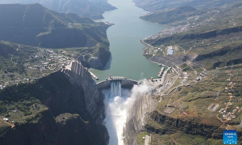 A flood discharging experiment is done at the Baihetan hydropower station, which straddles the provinces of Yunnan and Sichuan in southwest China, Oct. 29, 2022. The Baihetan hydropower station, the world's second-largest in terms of total installed capacity, went fully operational Tuesday in the upper section of the Yangtze River in southwest China, according to China Three Gorges Corporation.(Photo: Xinhua)