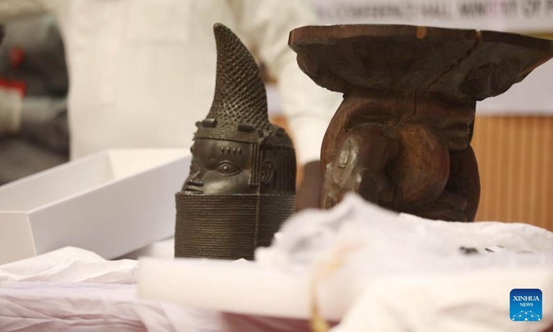 This photo taken on Dec. 20, 2022 shows artifacts returned by the German government to Nigeria at a handover ceremony in Abuja, Nigeria. Nigeria on Tuesday received 22 looted artifacts from the German government, as part of the official repatriation of 1,130 Benin bronzes taken away by European countries from the West African country over 120 years ago.(Photo: Xinhua)