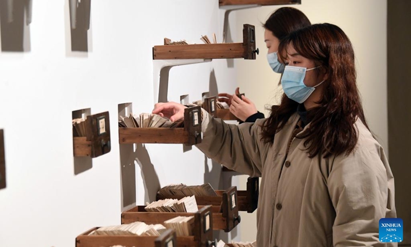 Visitors interact with art installations at Blooming Echoes, an exhibition featuring the combination of sound and modern art, at the Times Art Museum in Beijing, capital of China, Dec. 21, 2022.(Photo: Xinhua)