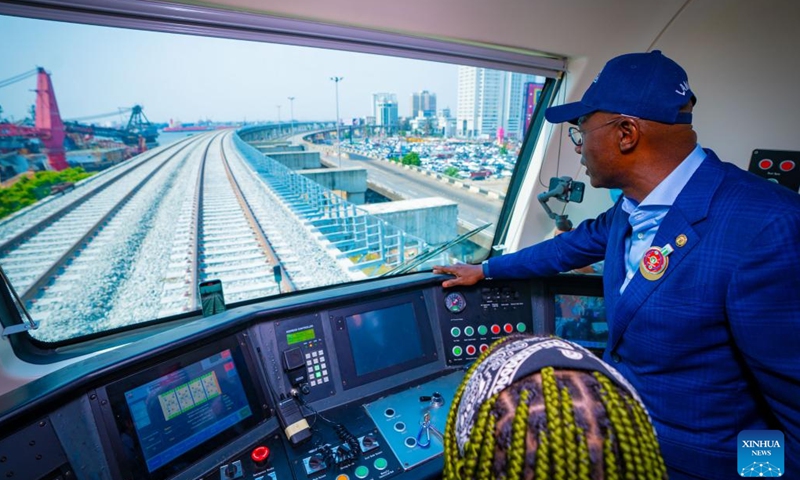 Invited guests take a test ride during a completion ceremony of a light rail project in Lagos, Nigeria, on Dec. 21, 2022. Nigeria's southwestern state of Lagos on Wednesday marked the completion of the first phase of a 27-km electric-powered light rail project.(Photo: Xinhua)