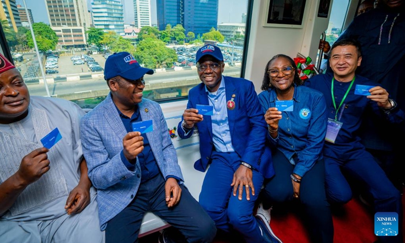 Invited guests take a test ride during a completion ceremony of a light rail project in Lagos, Nigeria, on Dec. 21, 2022. Nigeria's southwestern state of Lagos on Wednesday marked the completion of the first phase of a 27-km electric-powered light rail project.(Photo: Xinhua)