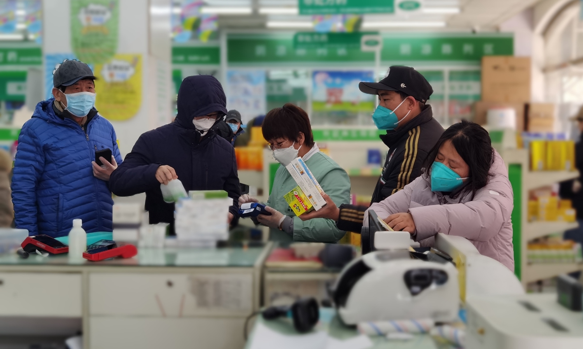 Customers purchase medical products in a pharmacy of Guoda Drugstore in Beijing. Photo: Courtesy of Sinopharm