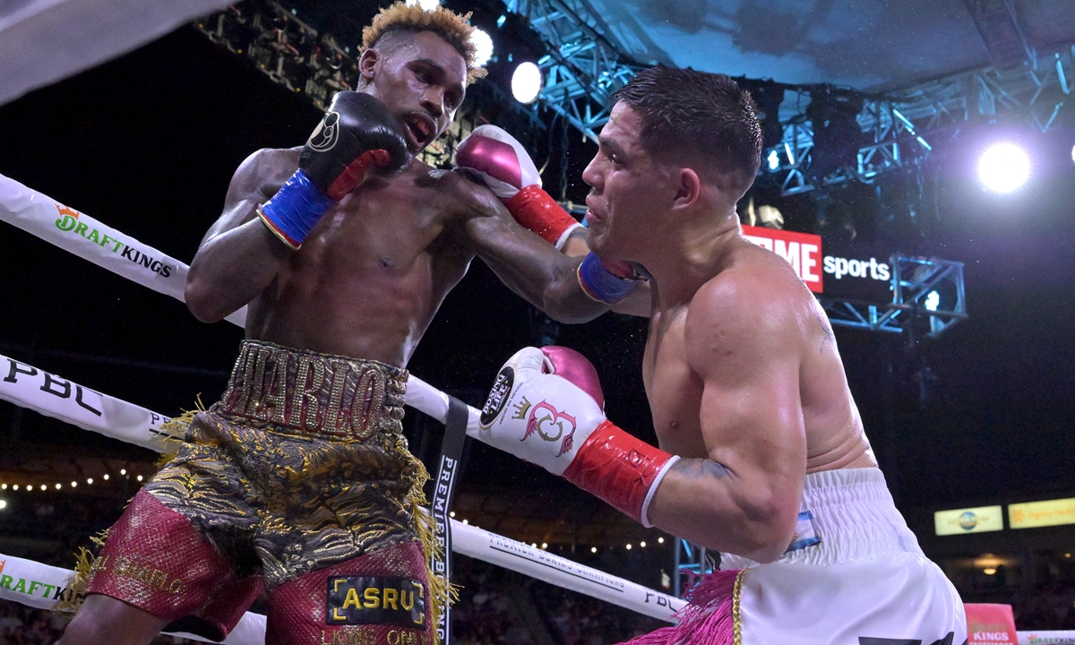 Jermell Charlo (left) exchanges punches in the ring with Brian Castano during a fight. File photo: AFP