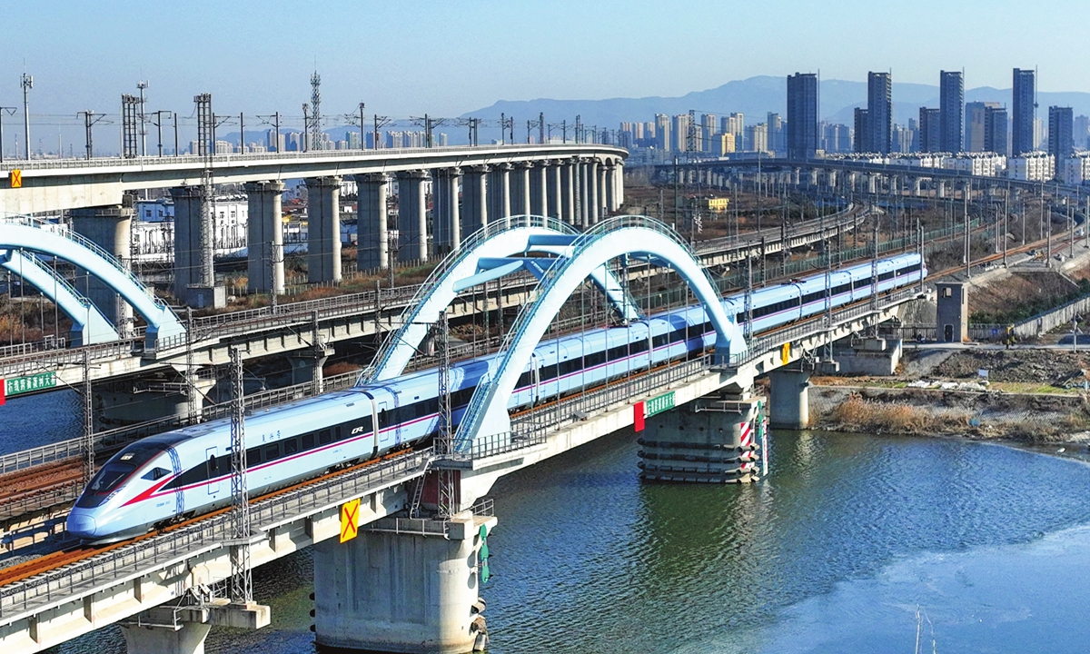Trains operate in Lianyungang, East China's Jiangsu Province on December 25, 2022. China's national railroad
will implement a new operating chart for the first quarter of 2023 starting on December 26. The new chart will
strengthen the operation of existing passenger and freight trains and ensure transport security after the 10
optimized anti-COVID measures were implemented. Photo: cnsphoto