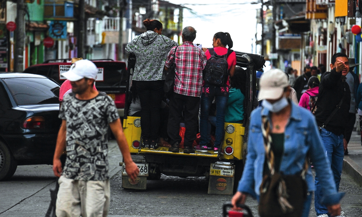 People walk on streets in Filandia, Colombia. Photo: AFP 