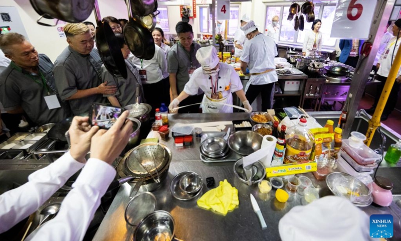 Chefs compete during the 2nd Malaysia-China Chinese Cuisine Master Chef Culinary Competition in Kuala Lumpur, Malaysia, Dec. 27, 2022. The 2nd Malaysia-China Chinese Cuisine Master Chef Culinary Competition was held here on Tuesday with 36 chefs vying for the master chef title.(Photo: Xinhua)