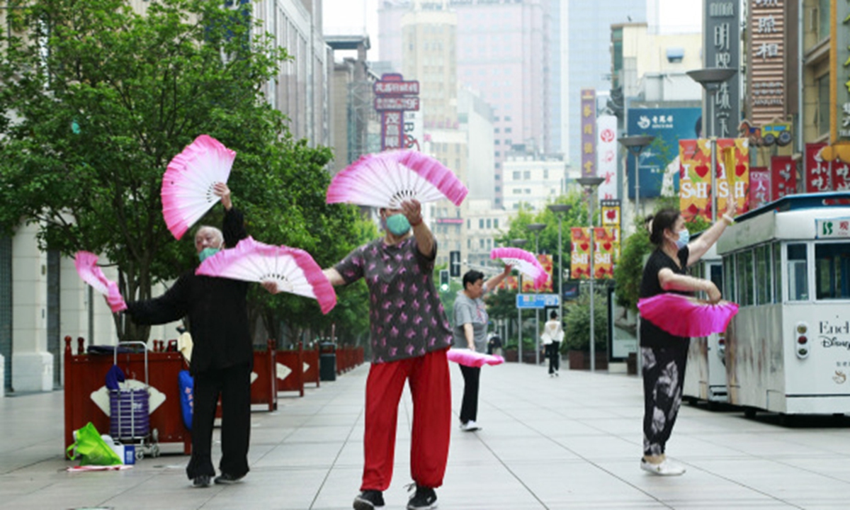 Locals exercise on the Nanjing Road Pedestrian in Shanghai. Photo: IC