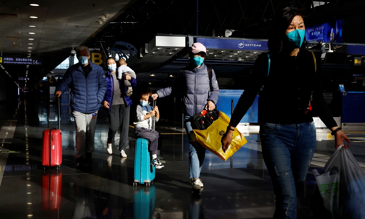 Travelers flock to Beijing Capital International Airport on December 27, 2022 as China further optimizes its anti-COVID measures. Photo: IC