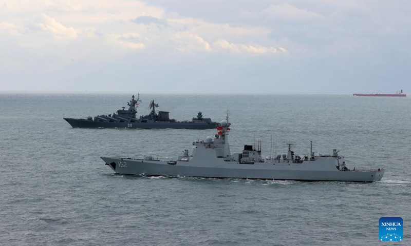 Destroyer Jinan from Chinese navy (front) and cruiser Varyag from Russian navy sail in formation after a joint naval exercise, Joint Sea 2022, in the East China Sea on Dec. 27, 2022. Chinese and Russian navies concluded the seven-day joint naval exercise Tuesday in the East China Sea.(Photo: Xinhua)