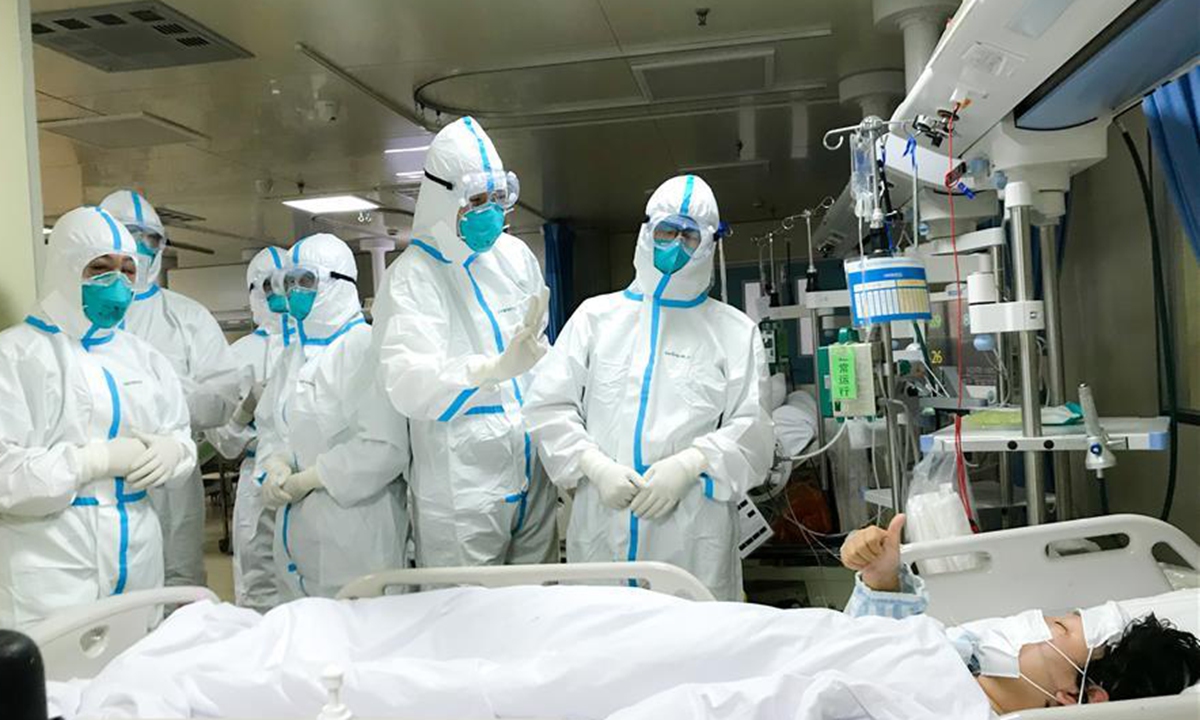 Medical team from the PLA Naval Medical University helped Hankou Hospital in Wuhan in January 2020. The photo shows members of the medical team of the PLA Naval Medical University being thanked by a patient at Hankou Hospital in Wuhan, Central China's Hubei Province, on January 27, 2020. Photo: Xinhua