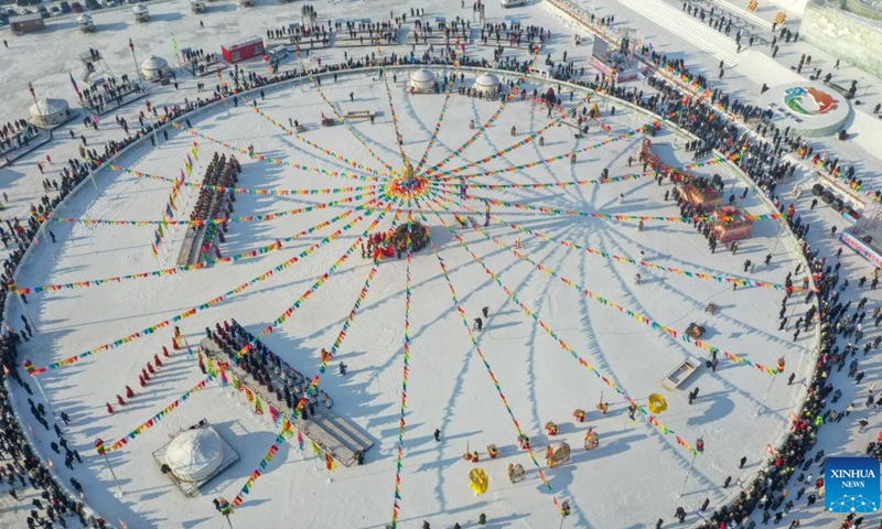 This aerial photo taken on Dec. 28, 2022 shows the opening ceremony of a winter fishing-themed festival on the Chagan Lake in Songyuan City, northeast China's Jilin Province. A winter fishing-themed festival opened on Wednesday at Chagan Lake, marking the beginning of the annual golden season for winter fishing here.(Photo: Xinhua)