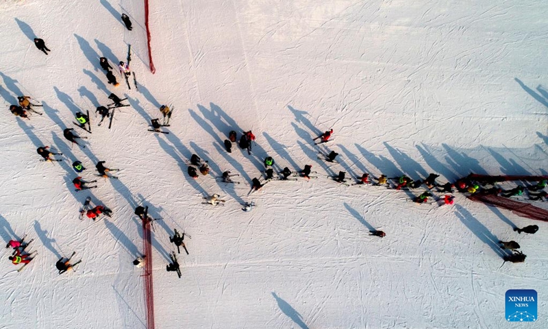This aerial photo taken on Jan. 2, 2023 shows people skiing at a ski resort in Shijiazhuang, north China's Hebei Province. (Photo by Liang Zidong/Xinhua)