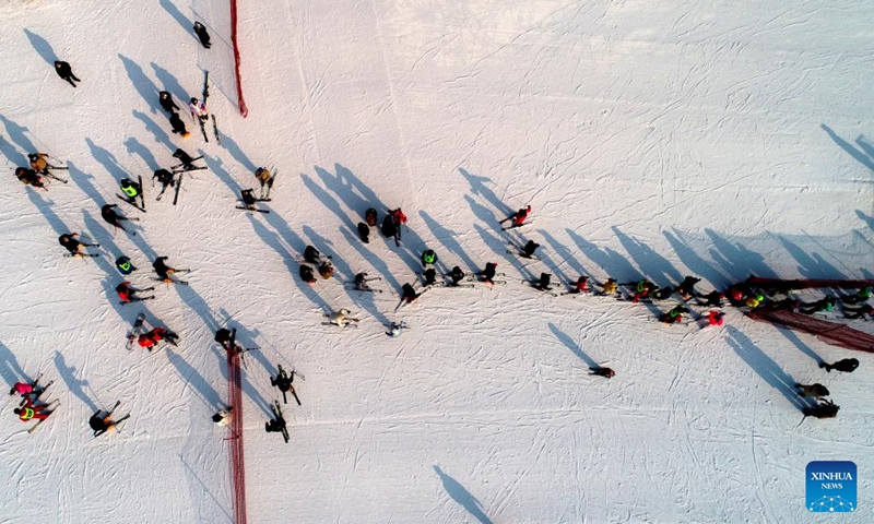 This aerial photo taken on Jan. 2, 2023 shows people skiing at a ski resort in Shijiazhuang, north China's Hebei Province. (Photo by Liang Zidong/Xinhua)