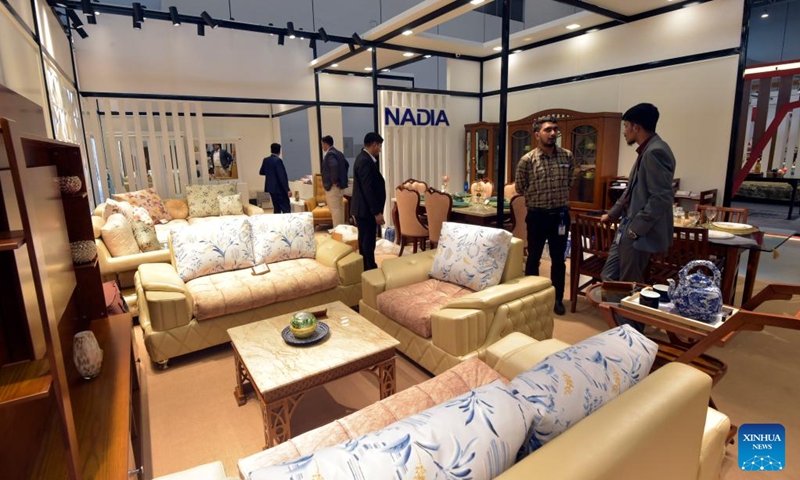 Visitors look at furniture at a stall during the Dhaka International Trade Fair in Purbachal on the outskirts of Dhaka, Bangladesh, on Jan. 1, 2023. The 27th edition of the Dhaka International Trade Fair, the largest annual commercial and trade event in Bangladesh, kicked off Sunday at the mega Chinese-built venue the Bangabandhu Bangladesh-China Friendship Exhibition Center. Photo: Xinhua