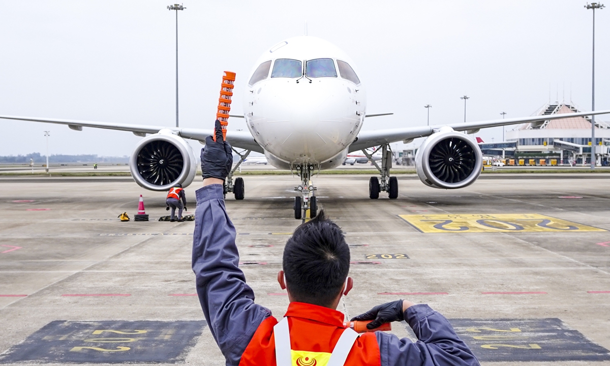 The world's first C919 aircraft, and also China's first domestically-developed passenger jet, arrives in Haikou Meilan International Airport, South China's Hainan Province on January 2, 2023. The C919 aircraft launched a 100-hour verification flight on December 26, 2022, flying across 10 airports in 10 provinces and cities including Beijing, Xi'an and Haikou. Photo: cnsphoto