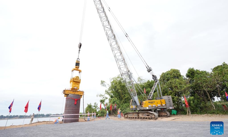 This photo taken on Jan. 1, 2023 shows the construction site of a China-funded bridge in Kratie province, Cambodia. Cambodia on Monday broke ground for the construction of a bridge across the Mekong River here in the country's northeastern part, with funds from China. (Photo by Van Pov/Xinhua)