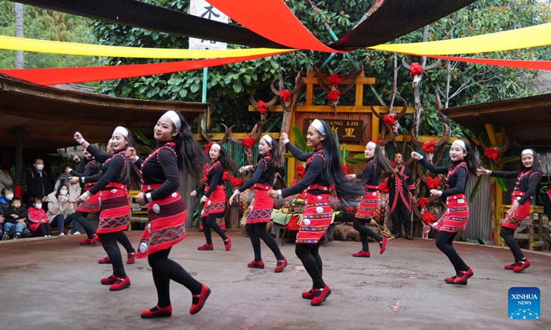 Actresses perform dance of Va ethnic group at a scenic spot in Kunming, southwest China's Yunnan Province, Dec. 31, 2022. (Photo by Liang Zhiqiang/Xinhua)