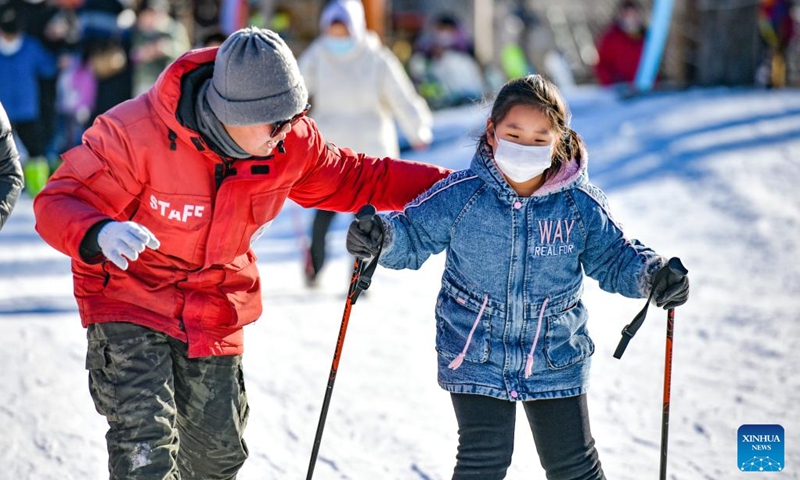 A child practices skiing at a theme park in Jizhou District, north China's Tianjin, Jan. 2, 2023. (Photo by Wang Jinyi/Xinhua)