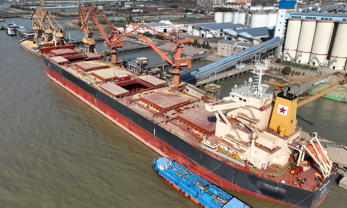 A cargo ship carrying imported Canadian barley berthed at a port in Nantong, East China's Jiangsu Province on January 3, 2023.  The grain imported totaled 21,499 tons, and it was the first shipment of grain imported by the port in 2023, said chinanews.cn, citing local customs. Photo: cnsphoto 