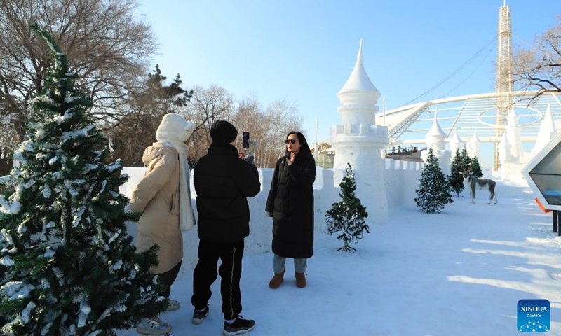 People have fun in Shenyang Expo Garden in Shenyang, northeast China's Liaoning Province, Jan. 3, 2023. Liaoning Province has rolled out a variety of ice-snow tourism activities to boost its winter tourism industry.During the three-day New Year holiday, Liaoning received about 6.27 million tourists, with tourism income reaching some 4.804 billion yuan (about 698 million U.S. dollars).(Photo: Xinhua)
