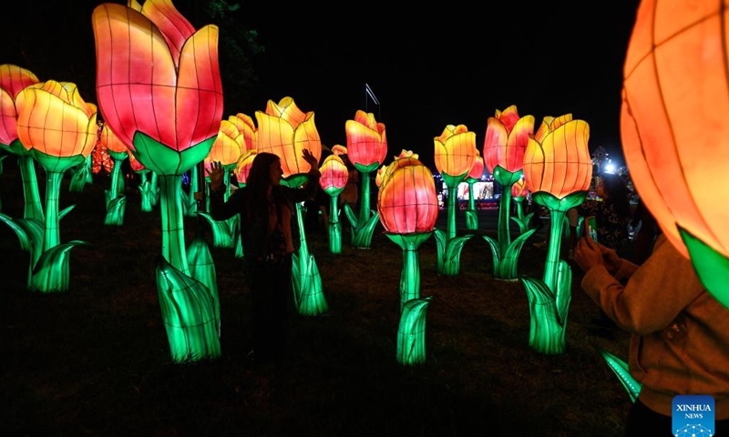 People enjoy colourful lanterns during a Chinese lantern festival at Orione park in Santiago, Chile, Jan. 3, 2023. The festival displaying 20 lantern groups kicked off here on Tuesday.(Photo: Xinhua)