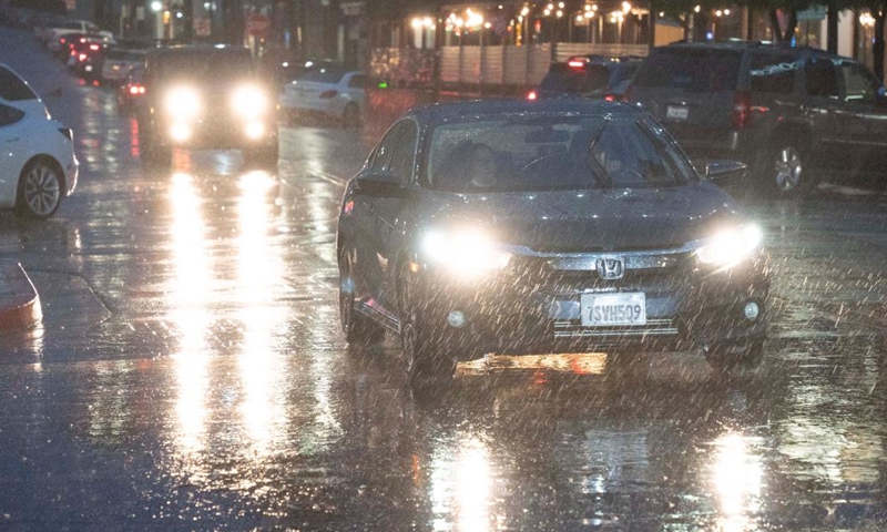 Vehicles drive in storm in Millbrae, California, the United States, Jan. 4, 2023. A winter storm hit northern California, bringing rain and snow to the local area.(Photo: Xinhua)
